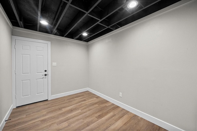 interior space with light wood-style floors and baseboards