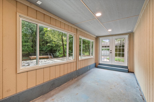 unfurnished sunroom with french doors