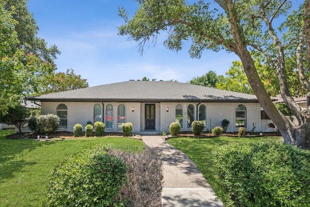 ranch-style home with a front yard