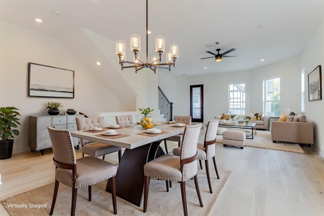 dining area featuring light wood-type flooring, stairway, visible vents, and recessed lighting