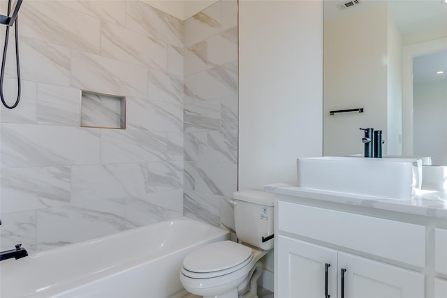 bathroom featuring visible vents, shower / bathing tub combination, vanity, and toilet