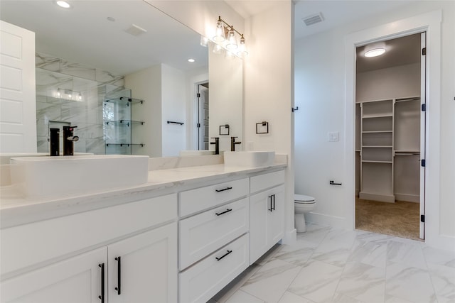 full bathroom with marble finish floor, visible vents, a sink, and a stall shower