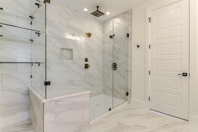 bathroom with a stall shower, marble finish floor, and recessed lighting