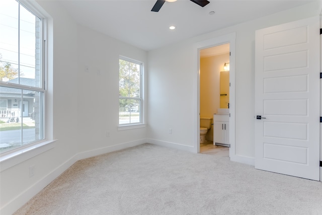 unfurnished bedroom with carpet, recessed lighting, a ceiling fan, ensuite bath, and baseboards