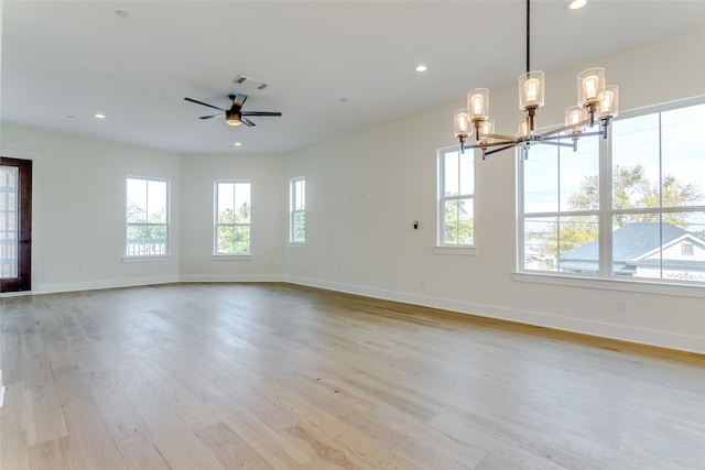 spare room with light wood finished floors, visible vents, and recessed lighting