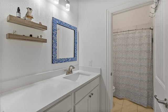 bathroom with tile patterned flooring, vanity, toilet, and a shower with shower curtain