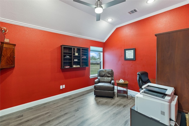 office featuring hardwood / wood-style flooring, ceiling fan, ornamental molding, and vaulted ceiling