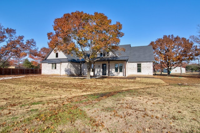 view of front of house with a front lawn