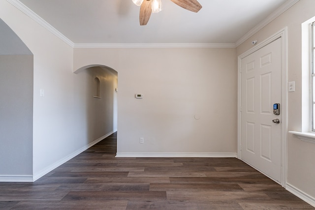 foyer with ceiling fan, dark hardwood / wood-style floors, and ornamental molding