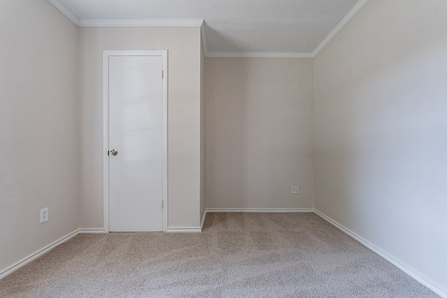 unfurnished room with carpet flooring and crown molding