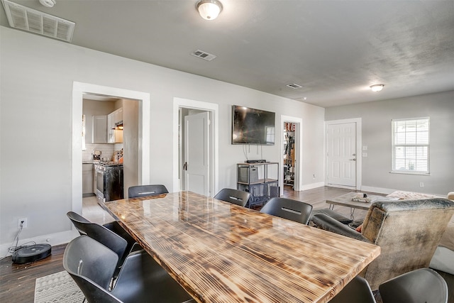 dining area with hardwood / wood-style floors