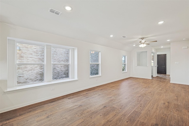 unfurnished living room featuring lofted ceiling, wood-type flooring, and ceiling fan