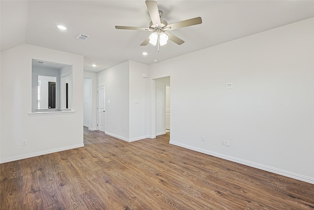 empty room featuring ceiling fan and hardwood / wood-style floors