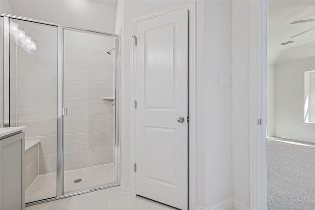 bathroom with a shower with door