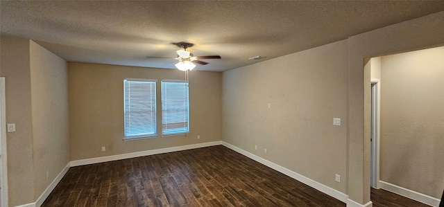 unfurnished room featuring ceiling fan, dark hardwood / wood-style floors, and a textured ceiling