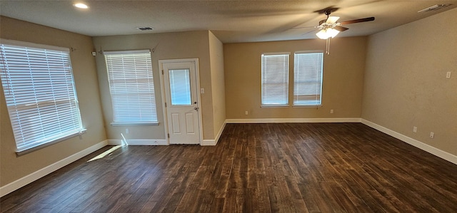 entryway featuring visible vents, baseboards, recessed lighting, ceiling fan, and dark wood-type flooring