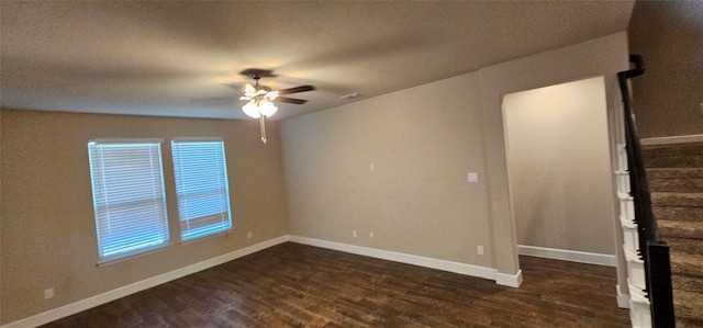 unfurnished room with ceiling fan and dark hardwood / wood-style floors