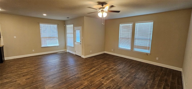 unfurnished room featuring dark hardwood / wood-style floors and ceiling fan