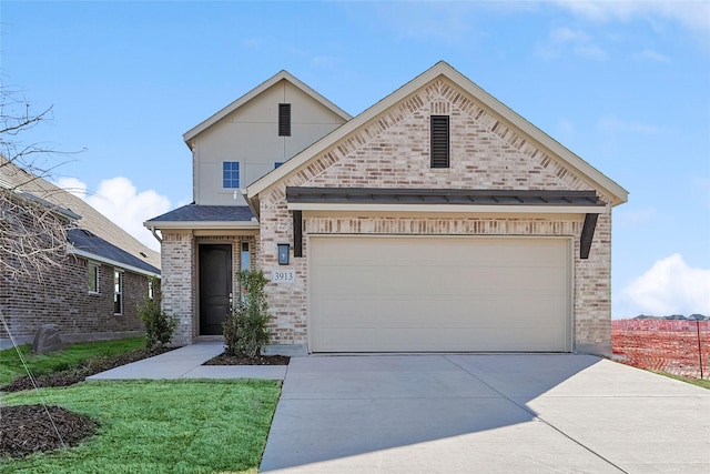 3913 Sky Dr, Sherman, TX 75090 - view of front facade with concrete driveway, brick siding, a garage, and a front yard