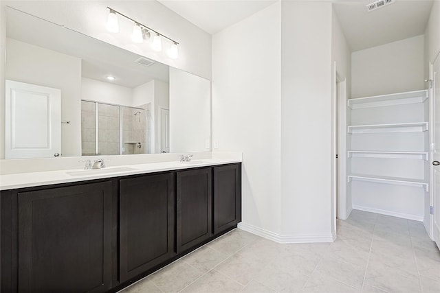 3913 Sky Dr, Sherman, TX 75090 - full bath featuring double vanity, a shower stall, and baseboards