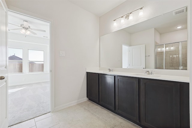 3913 Sky Dr, Sherman, TX 75090 - bathroom with double vanity, a shower stall, ceiling fan, and baseboards