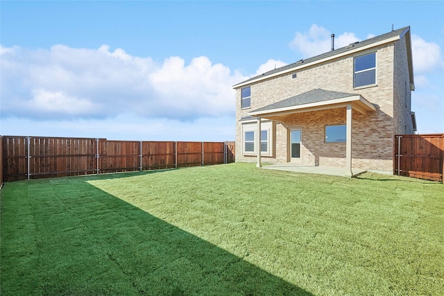 3913 Sky Dr, Sherman, TX 75090 - back of property featuring a patio, brick siding, and roof with shingles