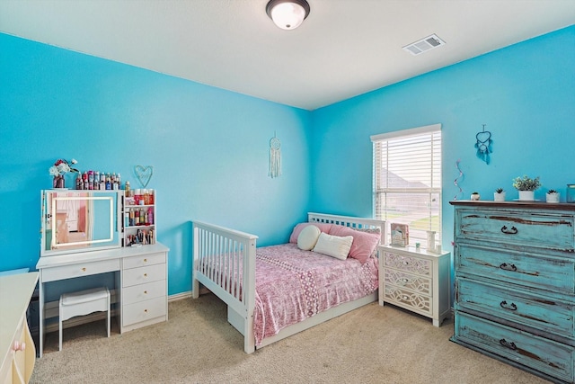 bedroom featuring light carpet