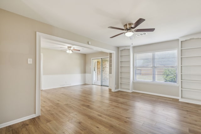 unfurnished living room featuring ceiling fan and light hardwood / wood-style flooring