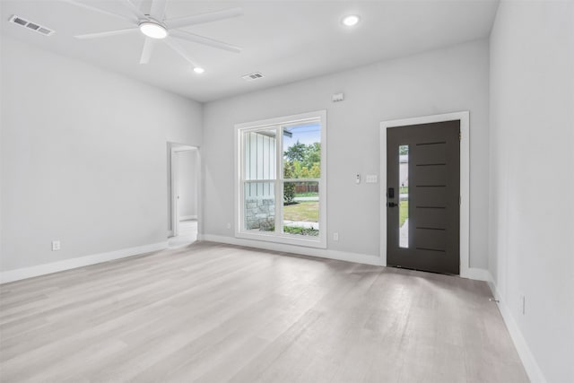 spare room featuring light hardwood / wood-style floors and ceiling fan