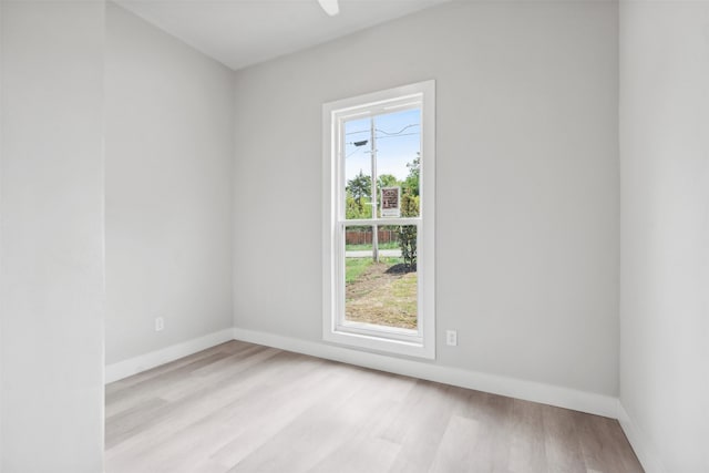 empty room featuring light hardwood / wood-style flooring and a healthy amount of sunlight