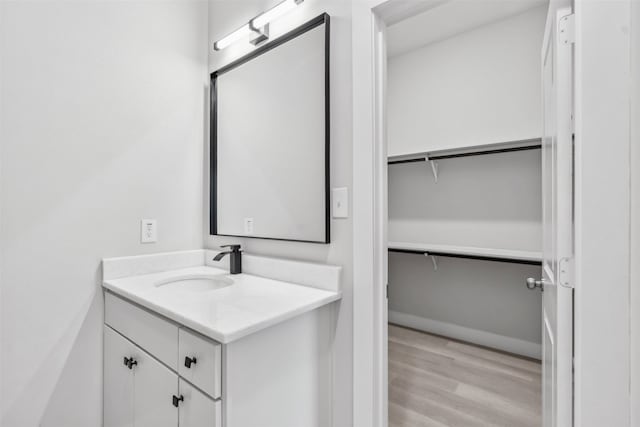 bathroom with vanity and wood-type flooring