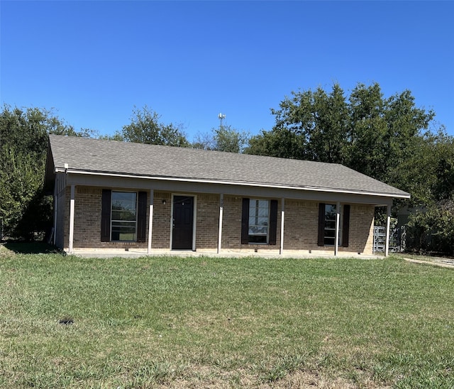 ranch-style house with a front lawn