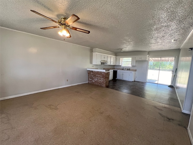 unfurnished living room featuring dark colored carpet, ceiling fan, and a textured ceiling