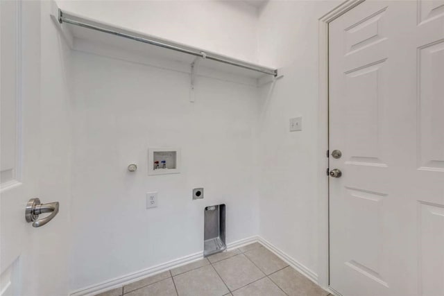 laundry area with gas dryer hookup, light tile patterned flooring, electric dryer hookup, and washer hookup