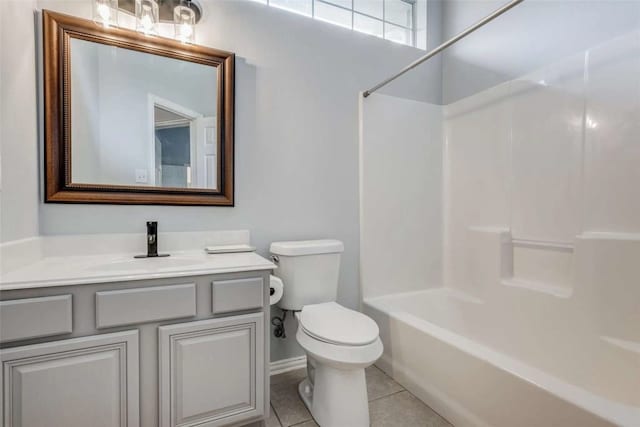 full bathroom with shower / tub combination, vanity, toilet, and tile patterned floors