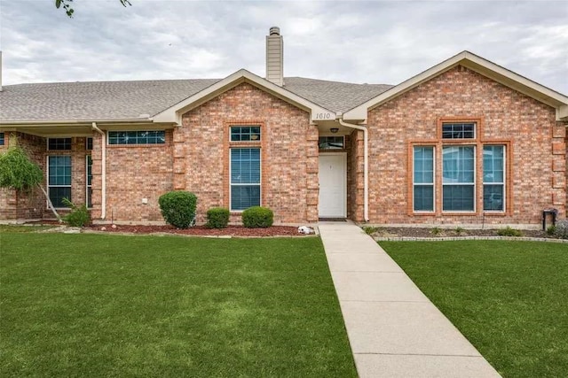 view of front of property with a front lawn