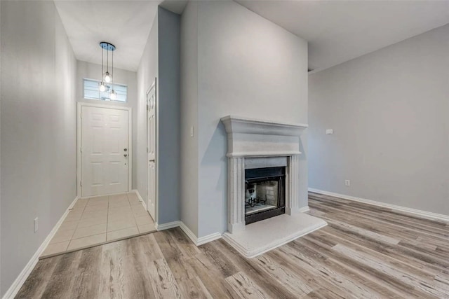 unfurnished living room featuring light hardwood / wood-style flooring