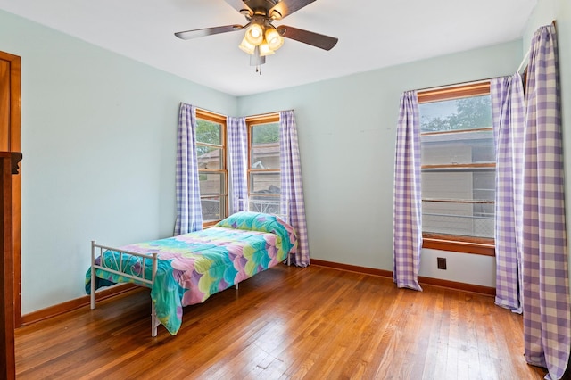 bedroom featuring ceiling fan and hardwood / wood-style flooring