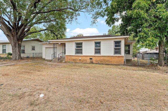 single story home featuring a front yard