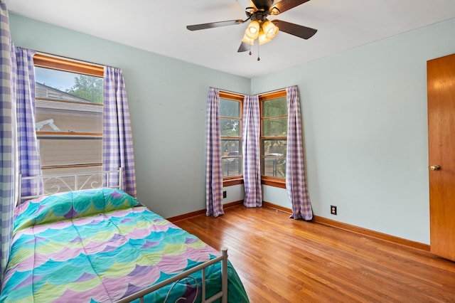 bedroom featuring ceiling fan and hardwood / wood-style flooring