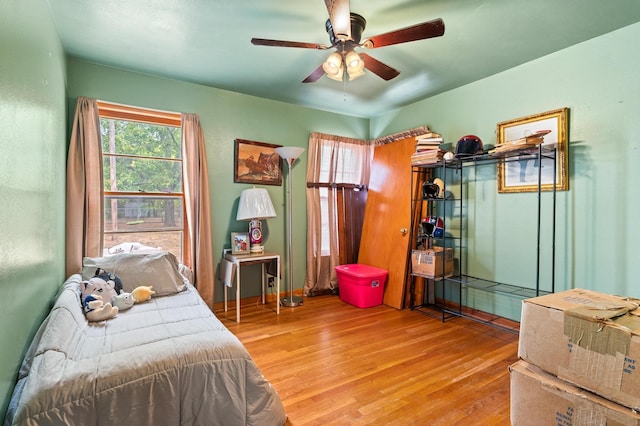 bedroom featuring ceiling fan and hardwood / wood-style flooring