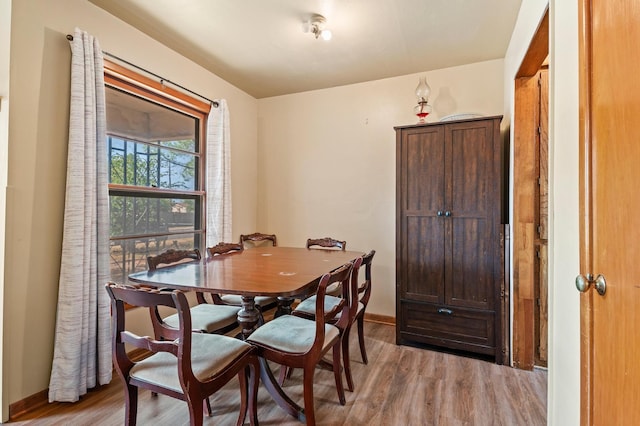 dining area with light hardwood / wood-style flooring