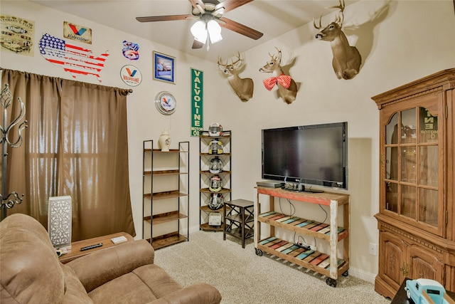 living room with carpet and ceiling fan