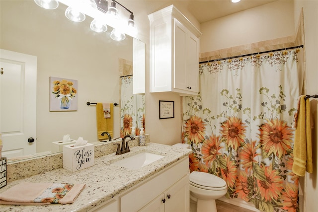 bathroom featuring walk in shower, vanity, toilet, and hardwood / wood-style flooring