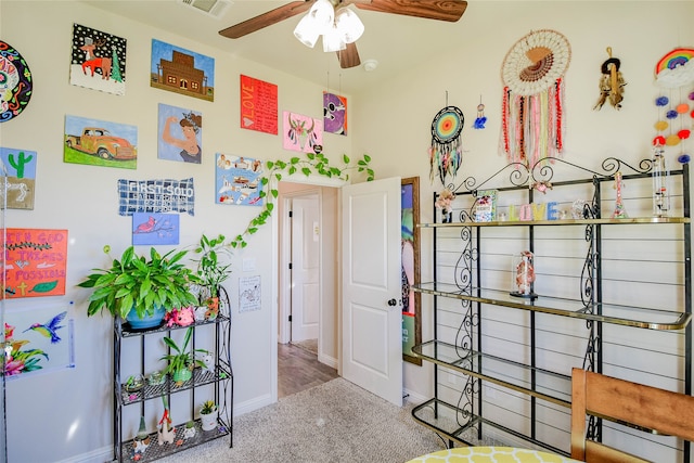 bedroom featuring ceiling fan and light colored carpet