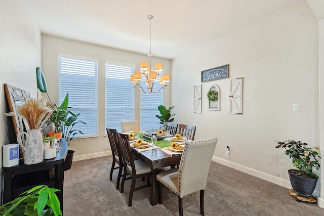 carpeted dining space with a chandelier