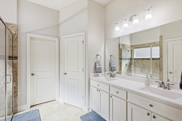 bathroom with vanity, tile patterned floors, and an enclosed shower