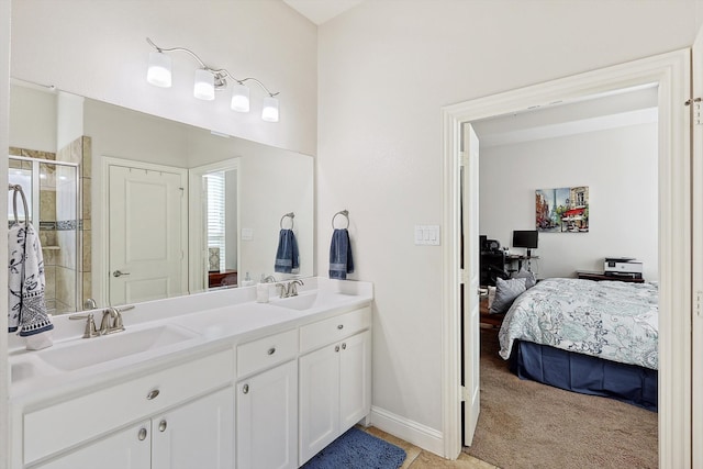 bathroom featuring a shower with door and vanity