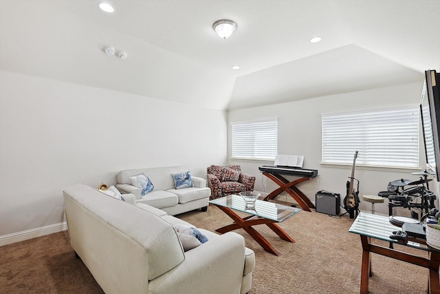 carpeted living room with lofted ceiling