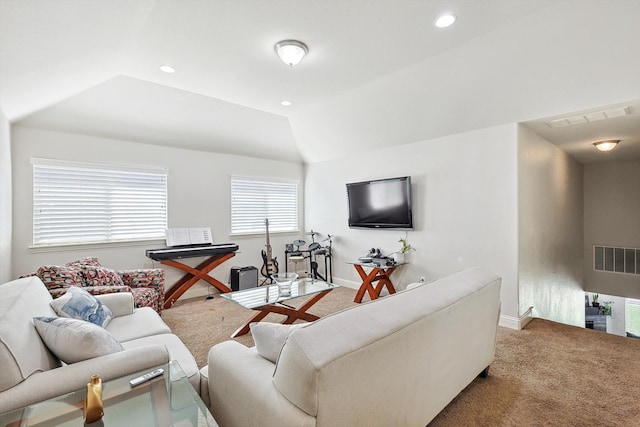 carpeted living room with lofted ceiling